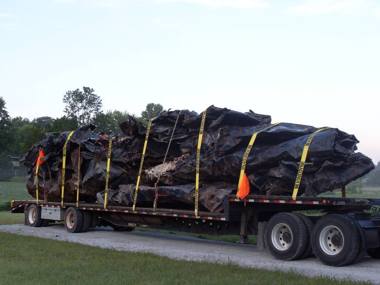 Harvestore Silos being Hauled in for Scrap